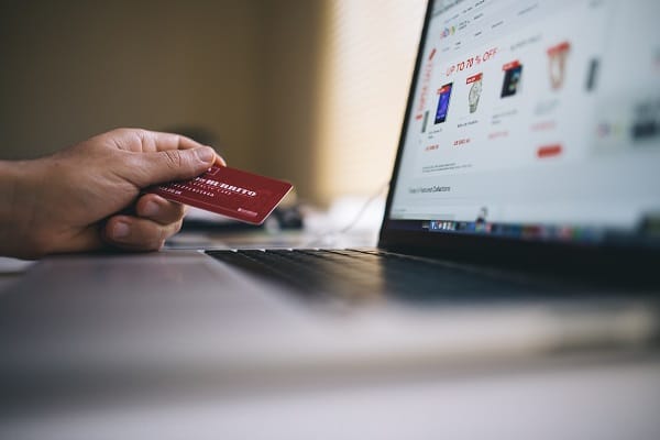 business customer holding credit card and shopping online